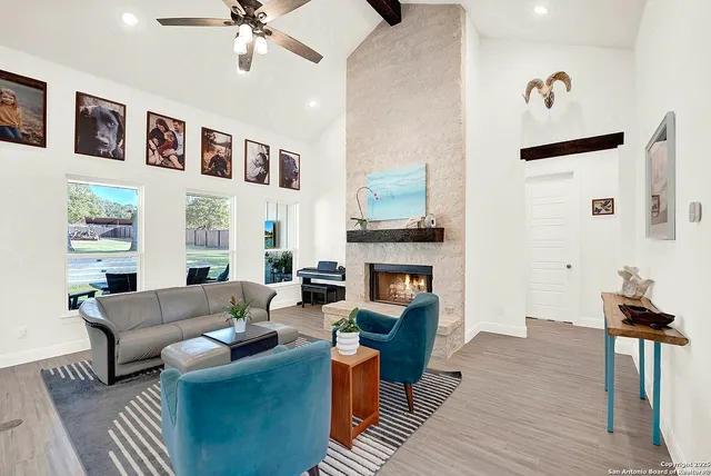 a living room with furniture and a fireplace