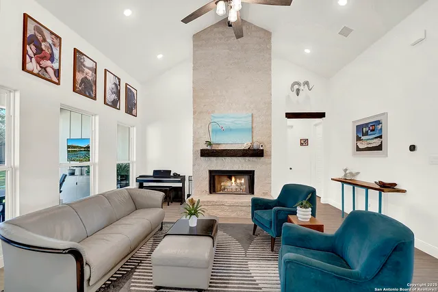 a living room with furniture and a fireplace