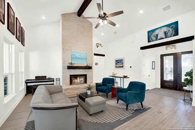 a living room with furniture and a fireplace