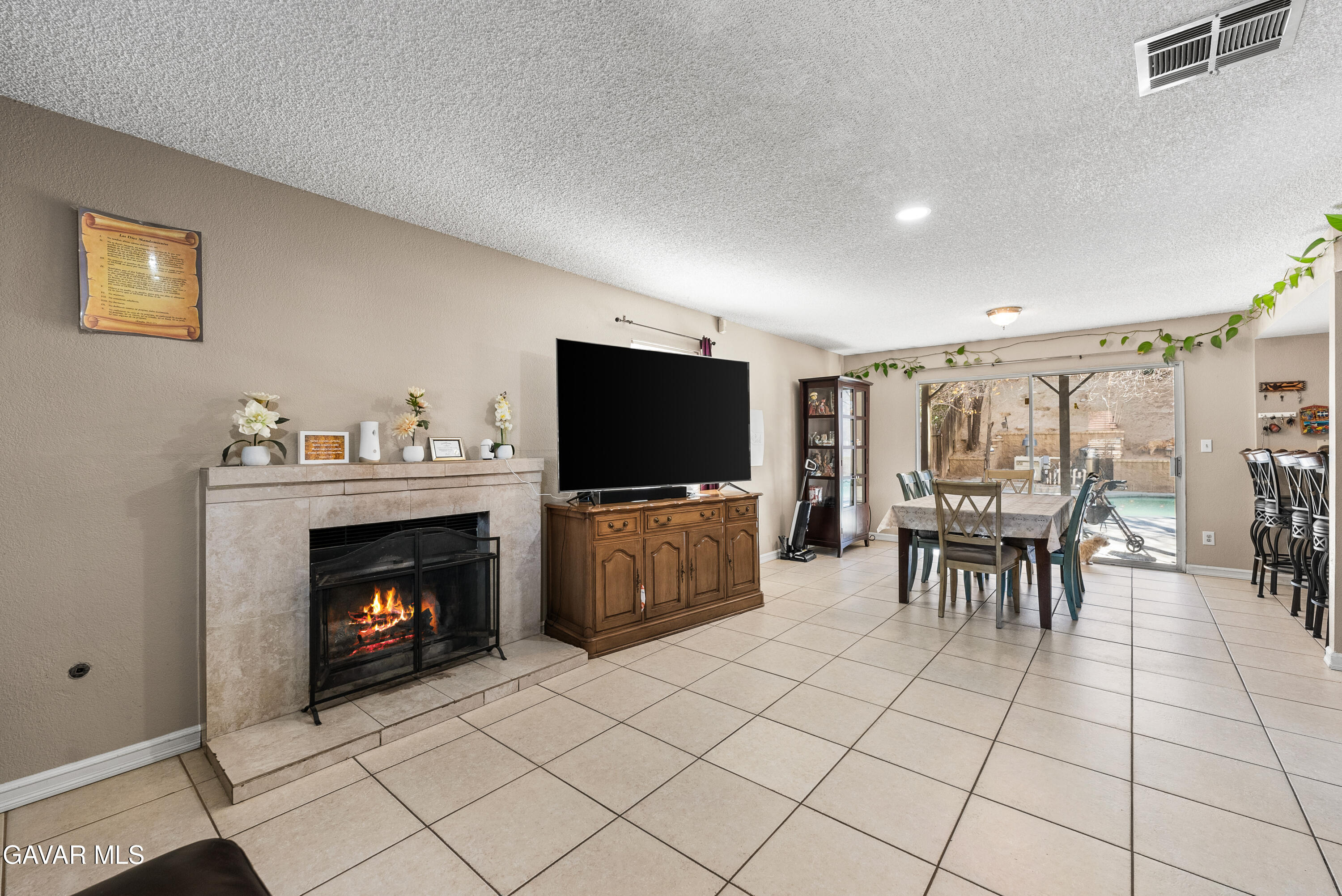 37635 Sandra Lane Palmdale, CA 93550 - Photo 20 of 46 a living room with furniture and a flat screen tv