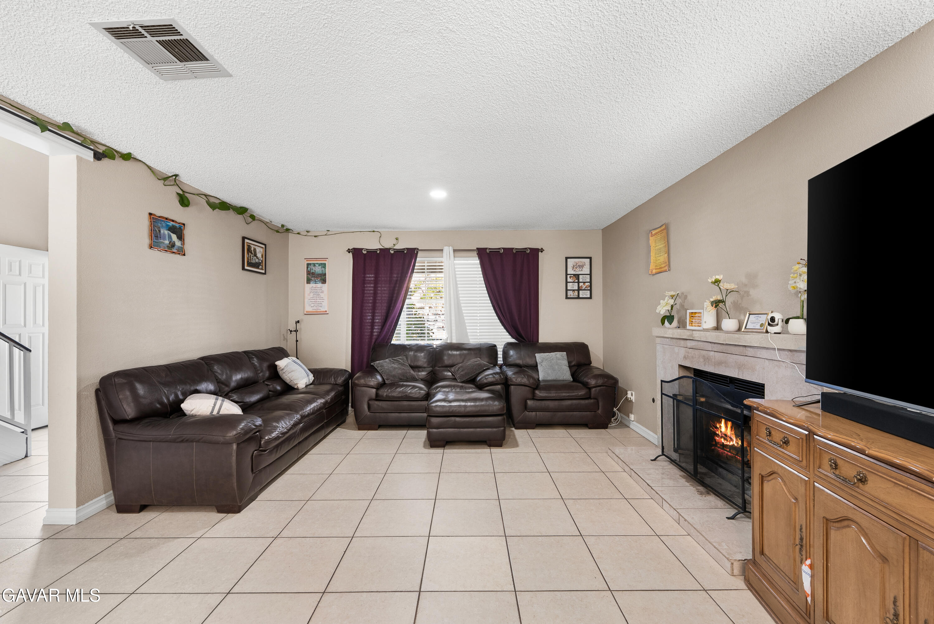 37635 Sandra Lane Palmdale, CA 93550 - Photo 25 of 46 a living room with furniture and a flat screen tv