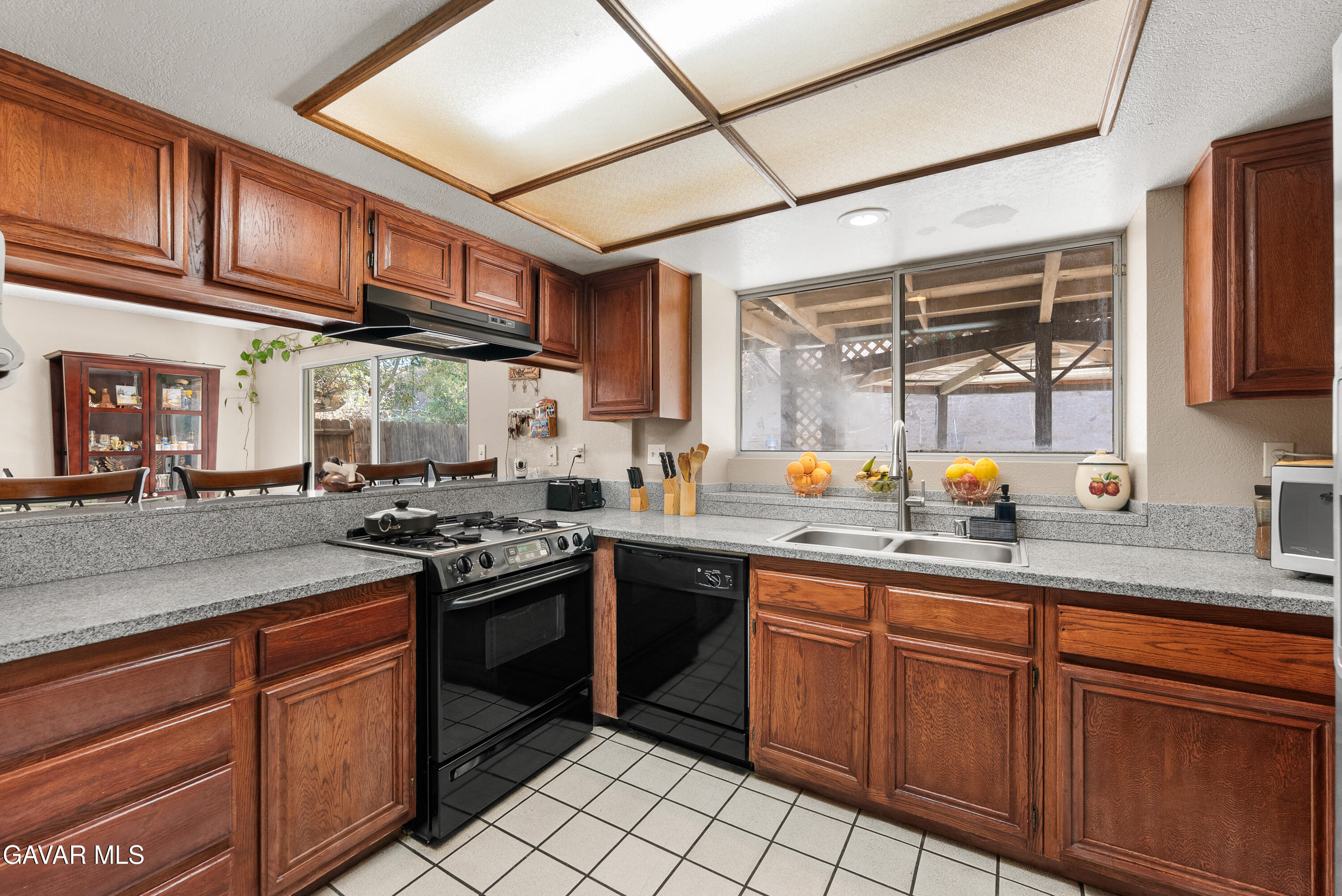 37635 Sandra Lane Palmdale, CA 93550 - Photo 29 of 46 a kitchen with stainless steel appliances granite countertop a sink and cabinets