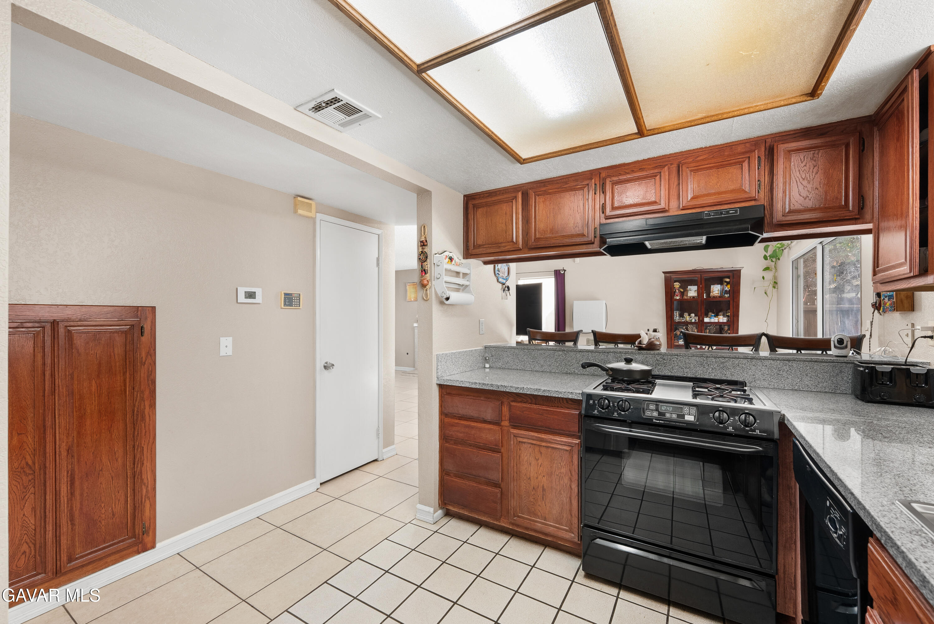 37635 Sandra Lane Palmdale, CA 93550 - Photo 31 of 46 a kitchen with stainless steel appliances granite countertop a stove and a sink