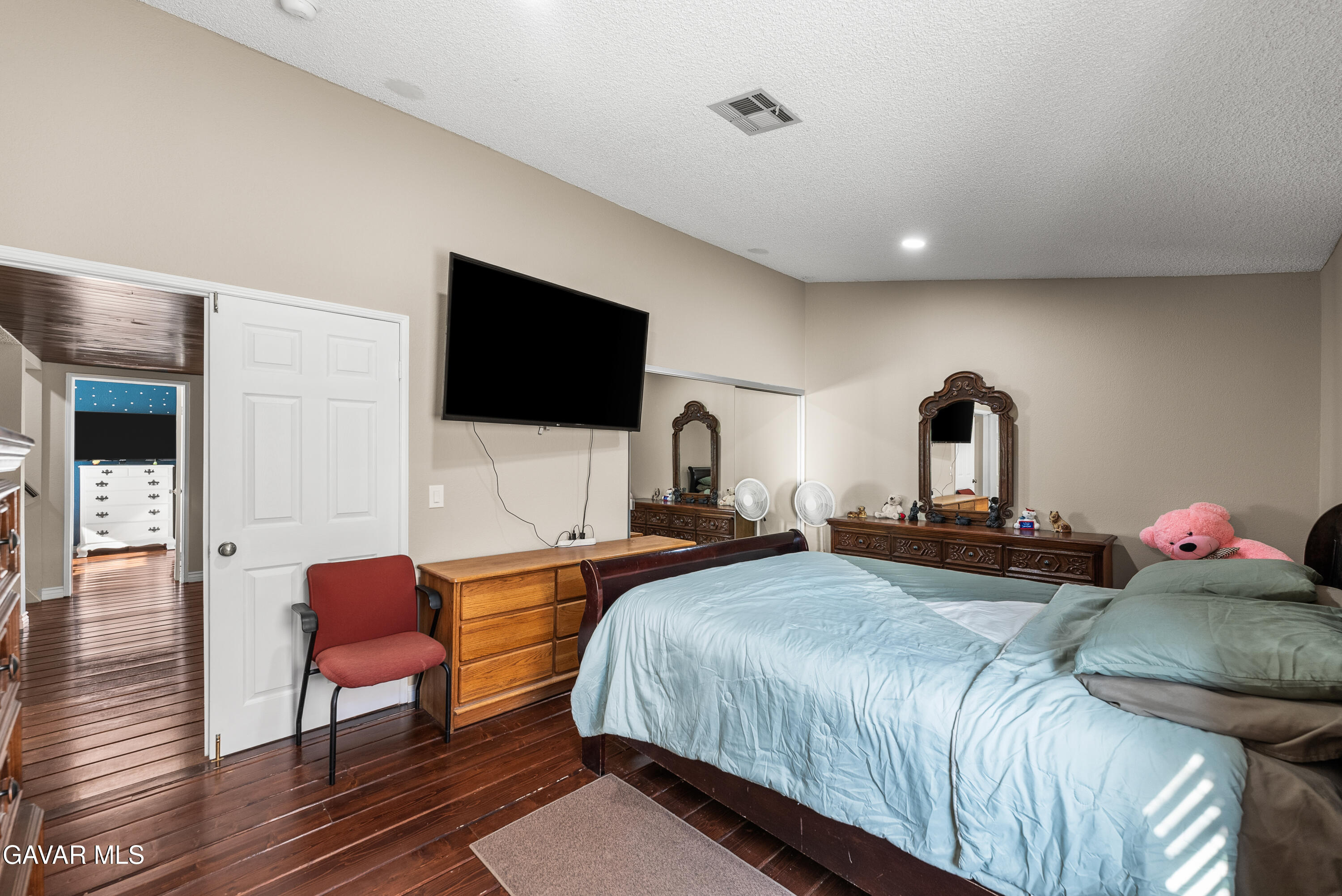 37635 Sandra Lane Palmdale, CA 93550 - Photo 38 of 46 a bedroom with a bed and a flat screen tv