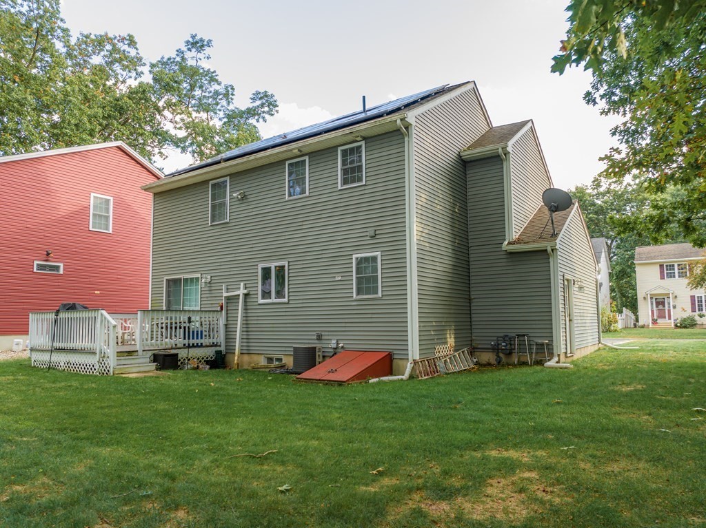 98 Briggs Street Springfield, MA 01151 - Photo 14 of 19 a backyard of a house with table and chairs