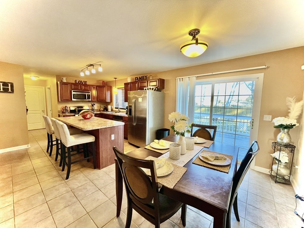98 Briggs Street Springfield, MA 01151 - Photo 15 of 19 a dining room with furniture and a window
