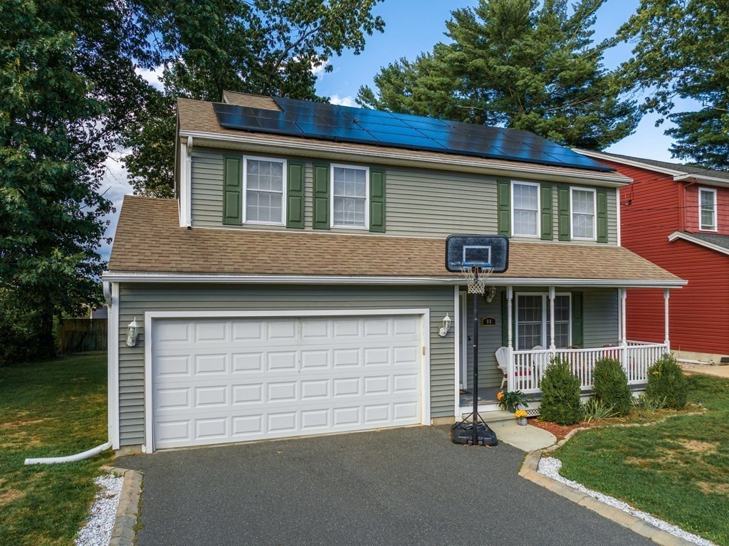 98 Briggs Street Springfield, MA 01151 - Photo 5 of 19 front view of a house with a yard