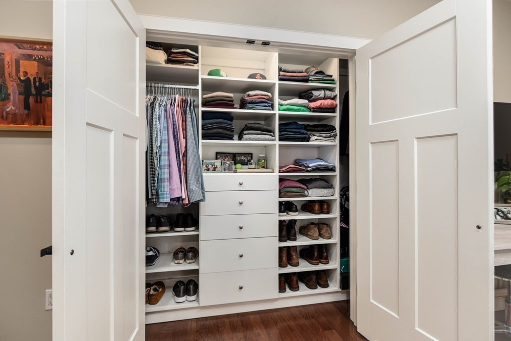 99 Brookley Road, Unit 1 Boston, MA 02130 - Photo 19 of 40 walk view of walk in closet with clothes and shoes