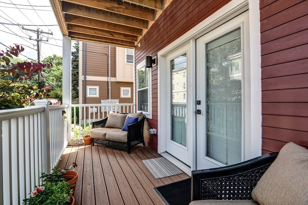 99 Brookley Road, Unit 1 Boston, MA 02130 - Photo 20 of 40 a view of a balcony with furniture