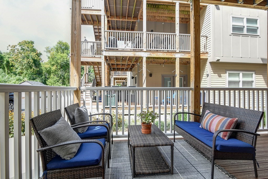 99 Brookley Road, Unit 1 Boston, MA 02130 - Photo 27 of 40 a view of a chair and bench in the balcony