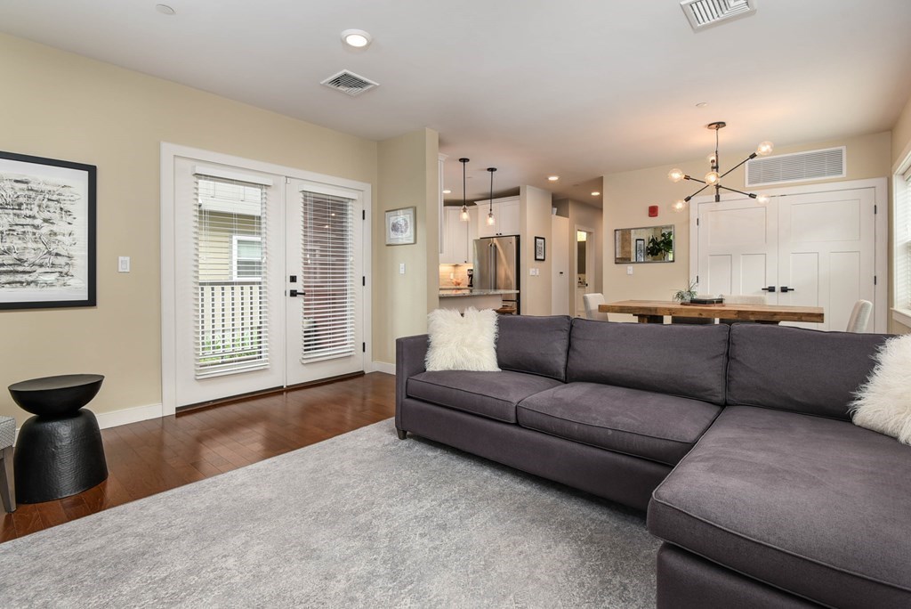 99 Brookley Road, Unit 1 Boston, MA 02130 - Photo 4 of 40 a living room with furniture and a window