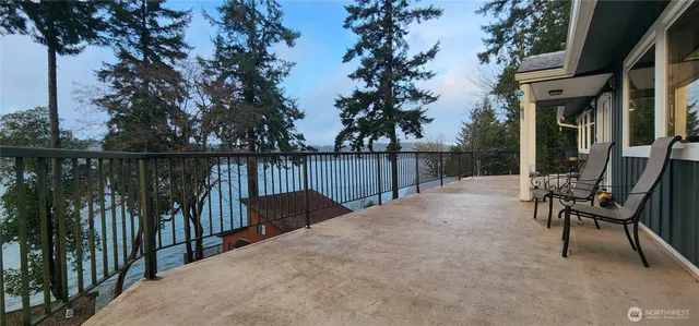 a view of a chair and table in the balcony