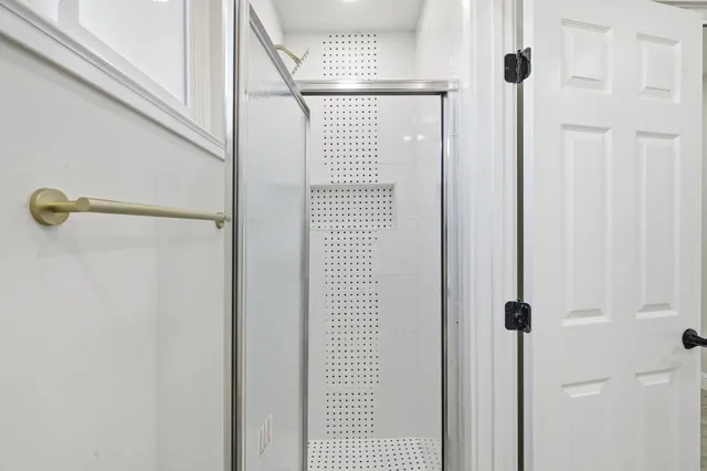 a view of a hallway with a white door