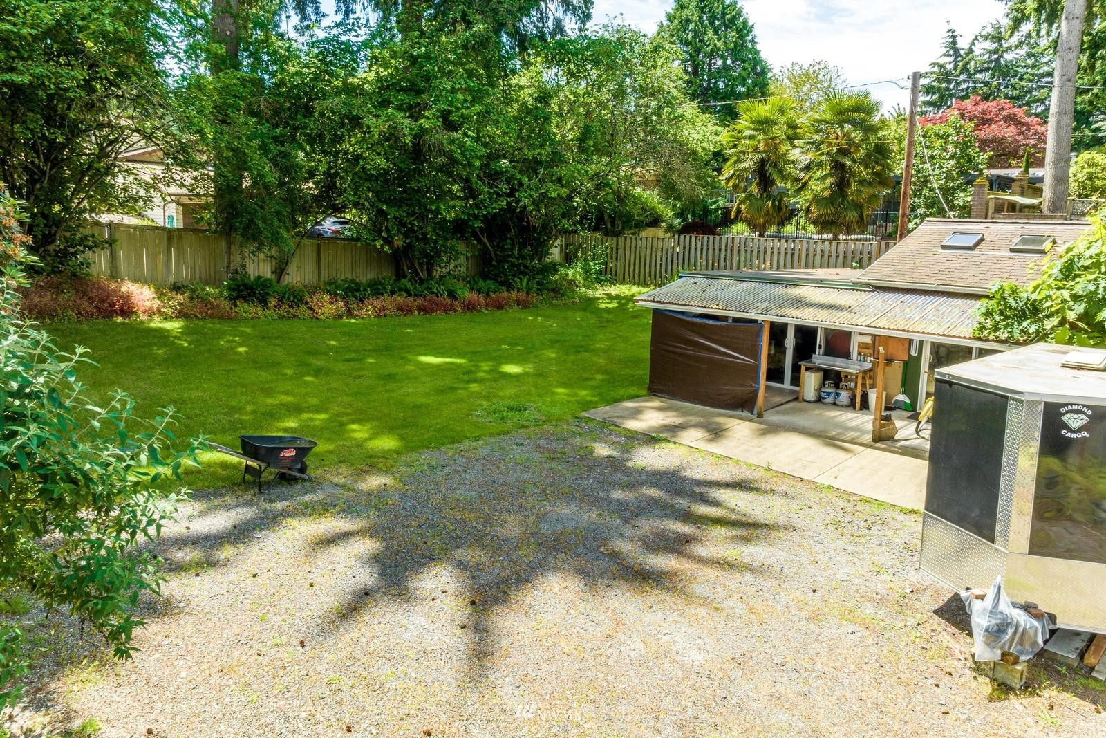 9325 Northeast 175th Street Bothell, WA 98011 - Photo 3 of 19 a view of a backyard with a garden and plants