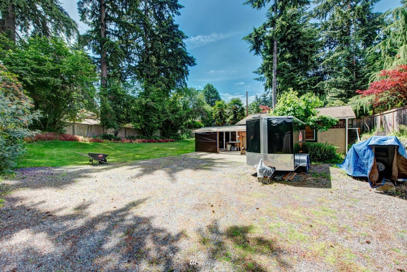 9325 Northeast 175th Street Bothell, WA 98011 - Photo 6 of 19 a view of a house with backyard sitting area and garden