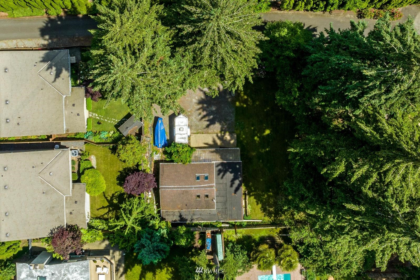9325 Northeast 175th Street Bothell, WA 98011 - Photo 10 of 19 an aerial view of a house with a yard and large trees