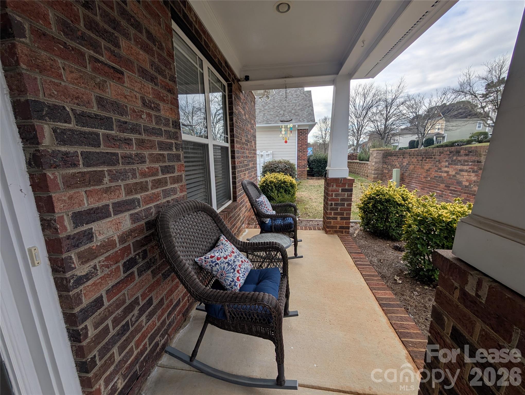 20207 Colony Point Lane Cornelius, NC 28031 - Photo 2 of 26 a view of a porch with chairs and a potted plant