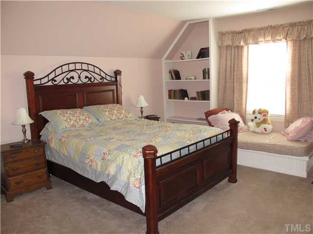 2509 Spruce Shadows Lane Raleigh, NC 27614 - Photo 12 of 21 Bonus room with a large sitting built-in area that is presently used as a guest room