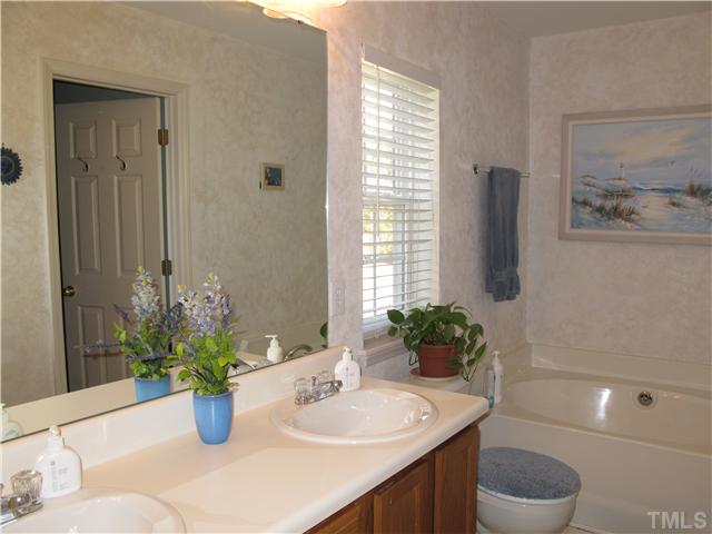 2509 Spruce Shadows Lane Raleigh, NC 27614 - Photo 14 of 21 Master bathroom has a garden tub, 2 sink vanity and a separate showe