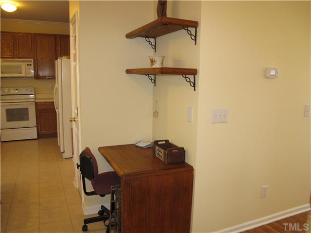 2509 Spruce Shadows Lane Raleigh, NC 27614 - Photo 7 of 21 Built in computer desk in the kitchen
