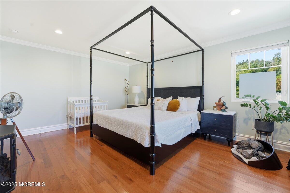 26 Ralph Street Highlands, NJ 07732 - Photo 14 of 51 a bedroom with a bed window and a potted plant