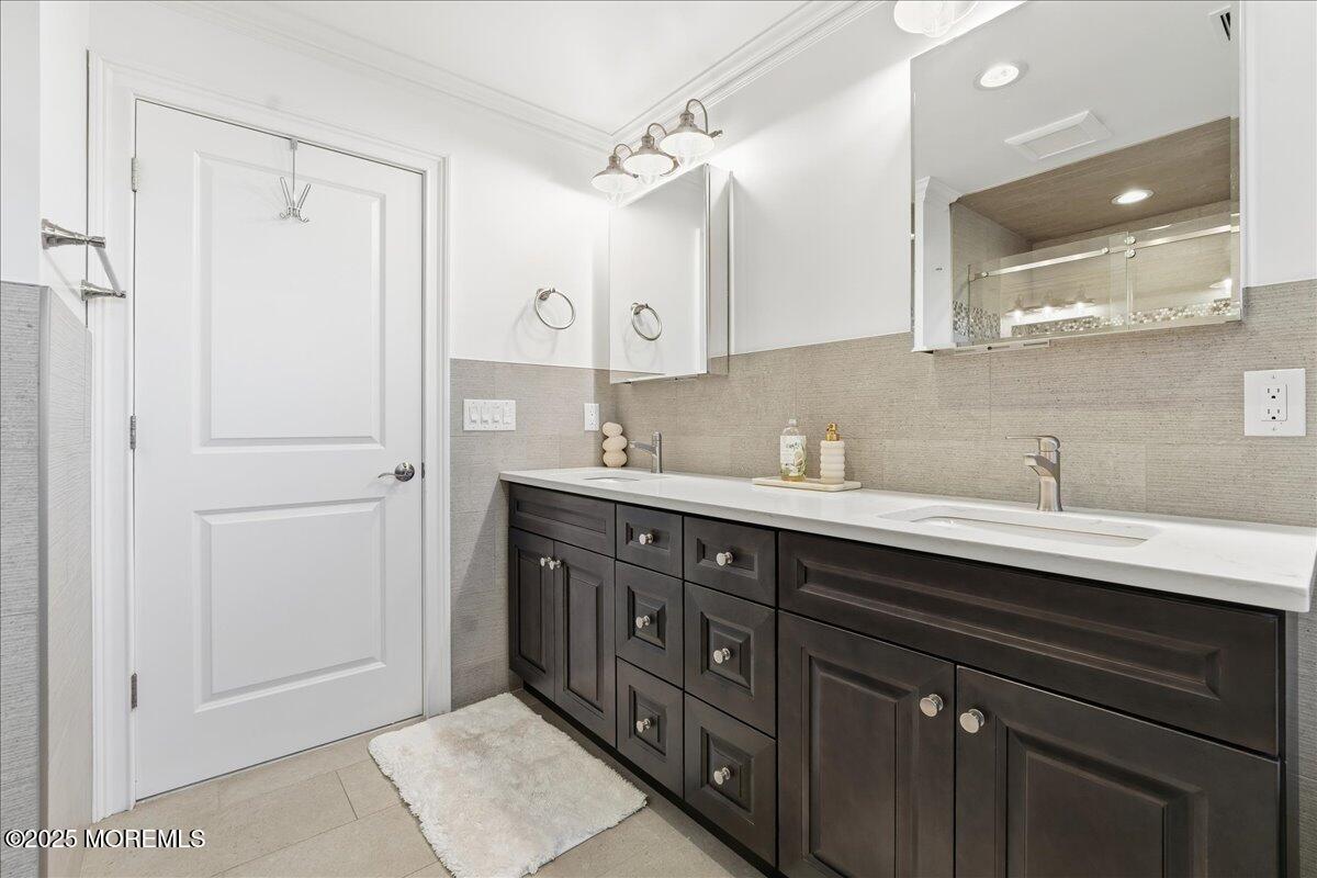 26 Ralph Street Highlands, NJ 07732 - Photo 16 of 51 a bathroom with a sink double vanity and a mirror