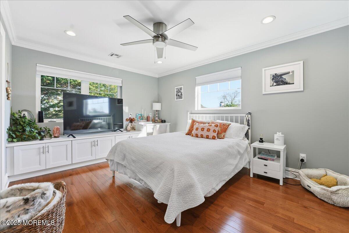 26 Ralph Street Highlands, NJ 07732 - Photo 18 of 51 a spacious bedroom with a large bed and a window