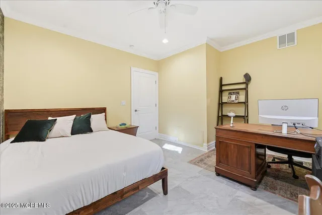 a bedroom with a bed and a table in it