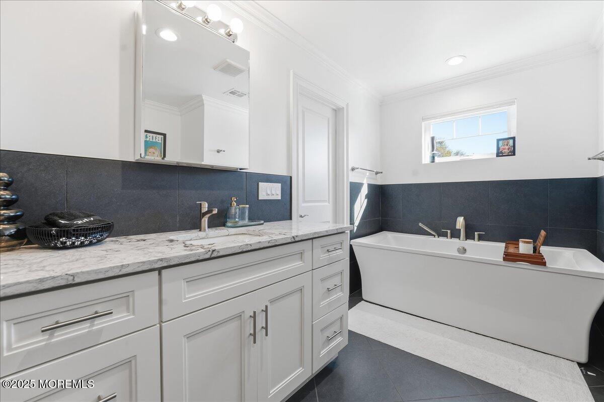 26 Ralph Street Highlands, NJ 07732 - Photo 21 of 51 a bathroom with a sink and a mirror