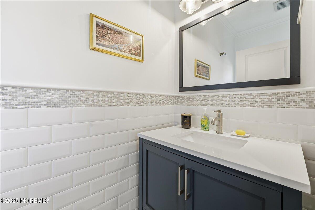 26 Ralph Street Highlands, NJ 07732 - Photo 25 of 51 a bathroom with a sink and a mirror