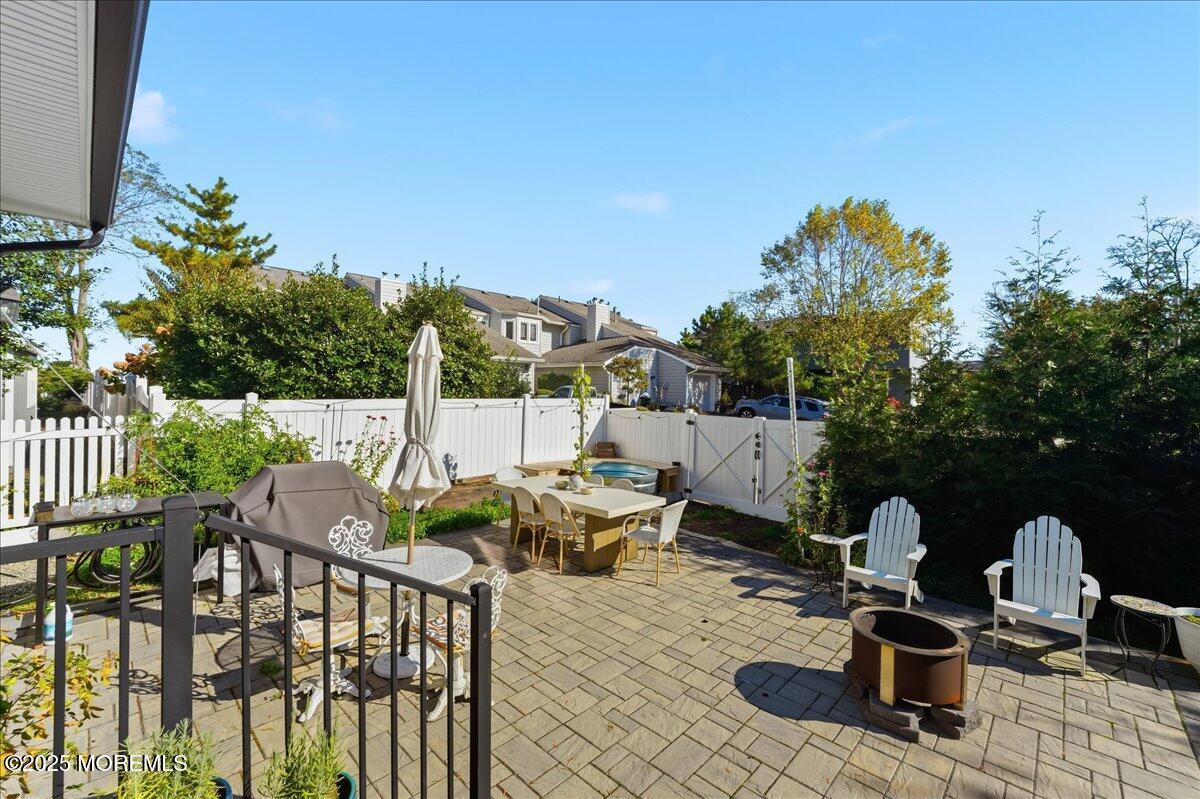 26 Ralph Street Highlands, NJ 07732 - Photo 30 of 51 a view of a balcony with chairs and iron fence
