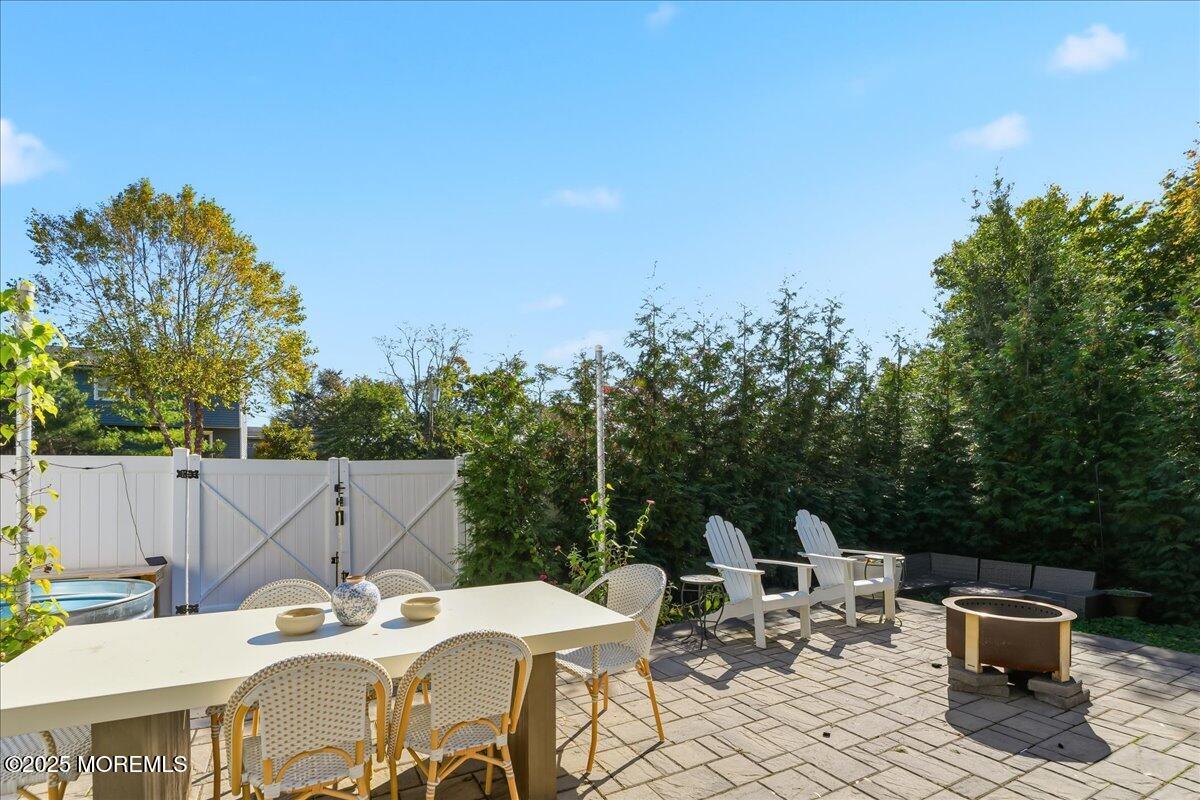 26 Ralph Street Highlands, NJ 07732 - Photo 31 of 51 a view of a dinning table and chairs in the patio