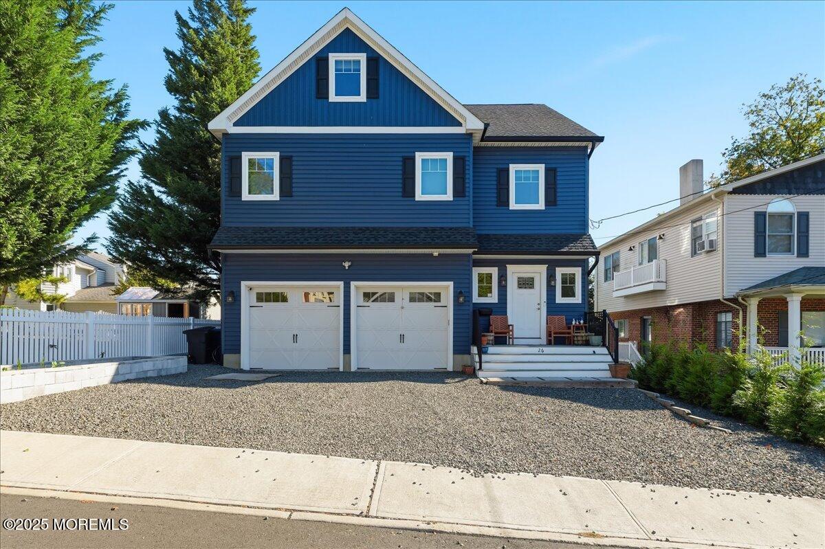 26 Ralph Street Highlands, NJ 07732 - Photo 36 of 51 a front view of a house with a yard and garage