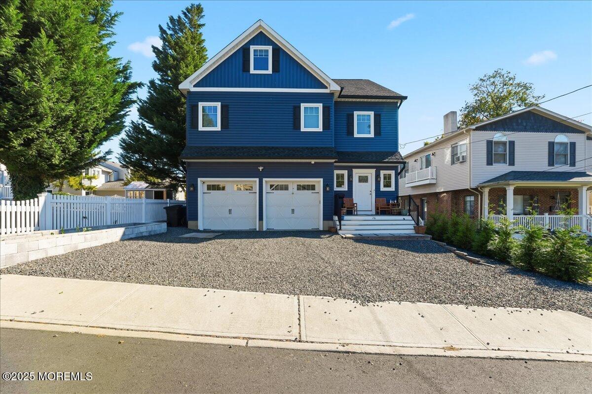 26 Ralph Street Highlands, NJ 07732 - Photo 37 of 51 a front view of a house with a yard and garage