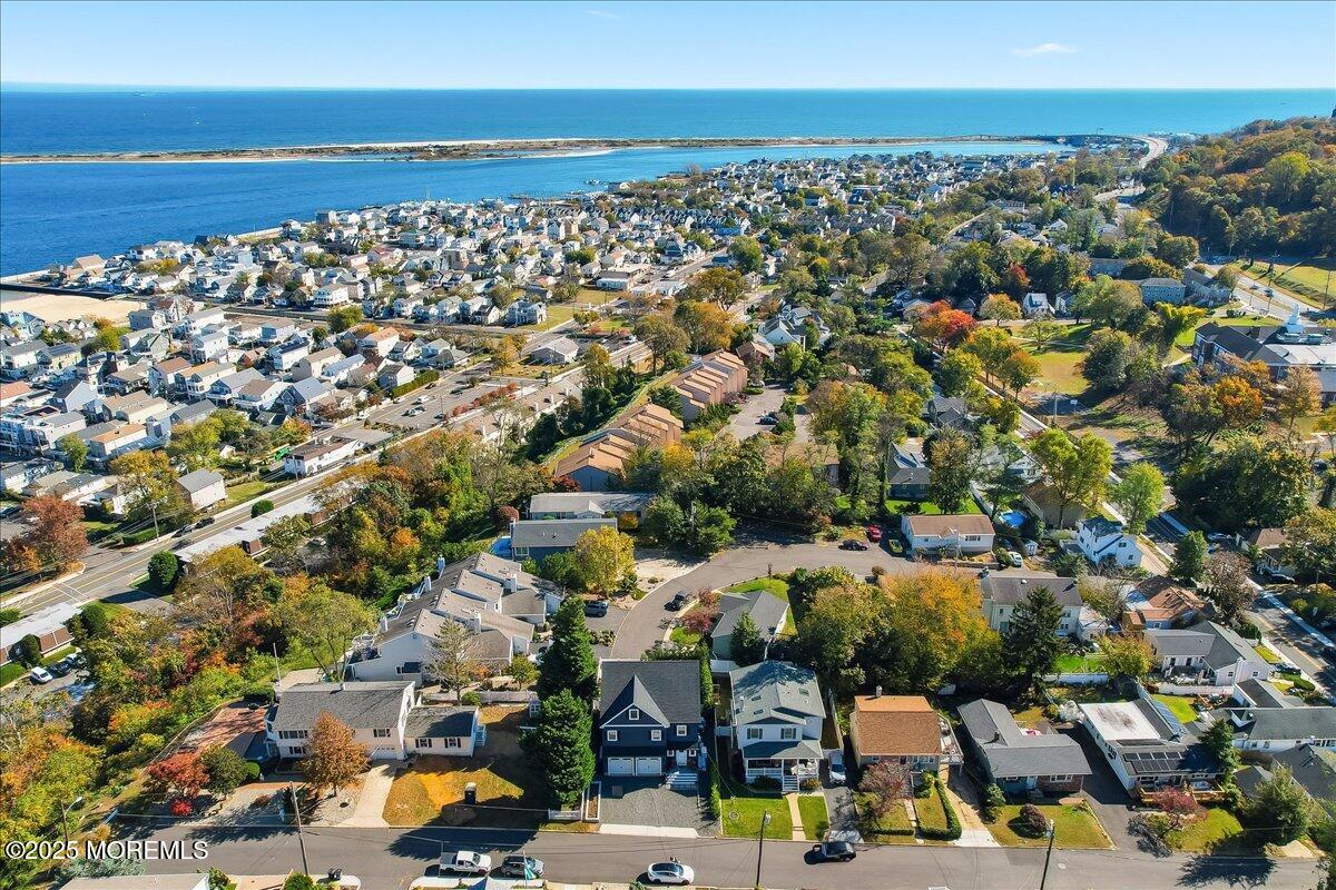 26 Ralph Street Highlands, NJ 07732 - Photo 46 of 51 an aerial view of a city with lots of residential buildings and ocean view in back