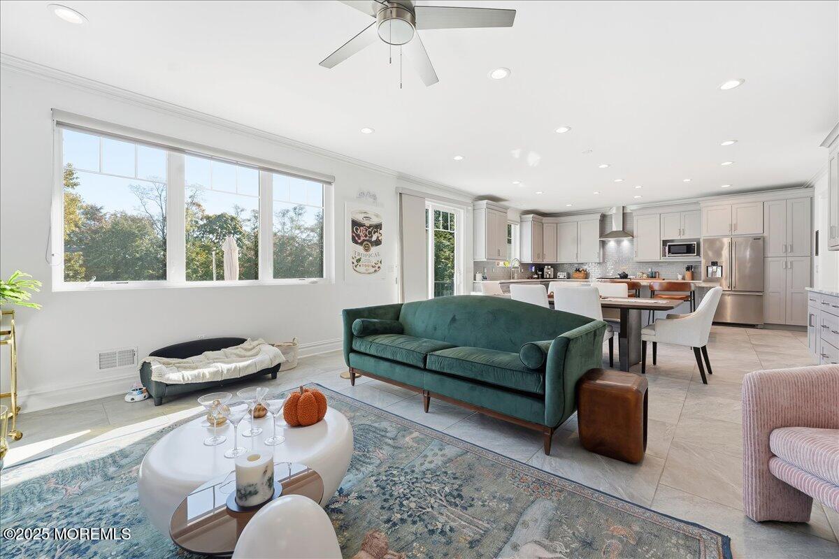 26 Ralph Street Highlands, NJ 07732 - Photo 9 of 51 a living room with furniture and a large window
