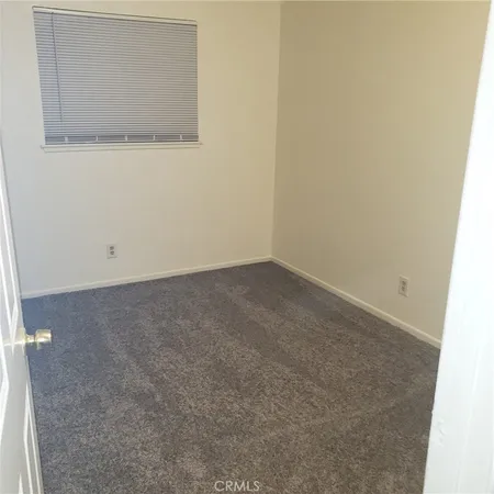 a white toilet sitting next to a bath tub