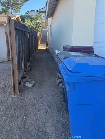 a view of a backyard with a small cabin and a chair
