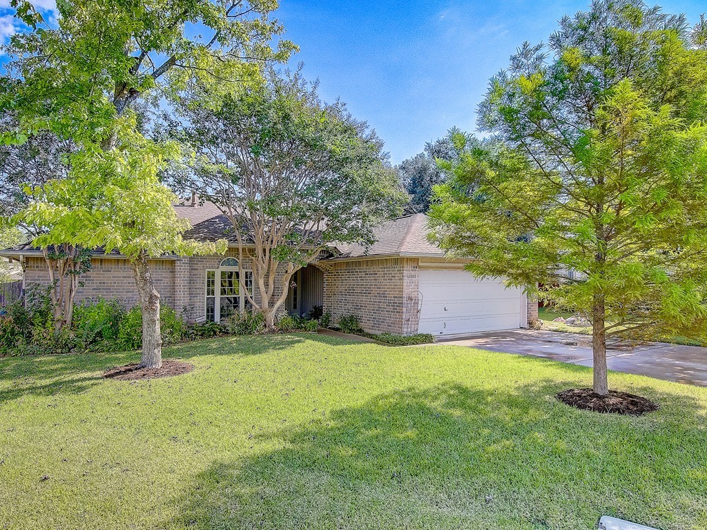 12807 Decoy Cove Austin, TX 78729 - Photo 1 of 1 a view of a house with a yard and tree