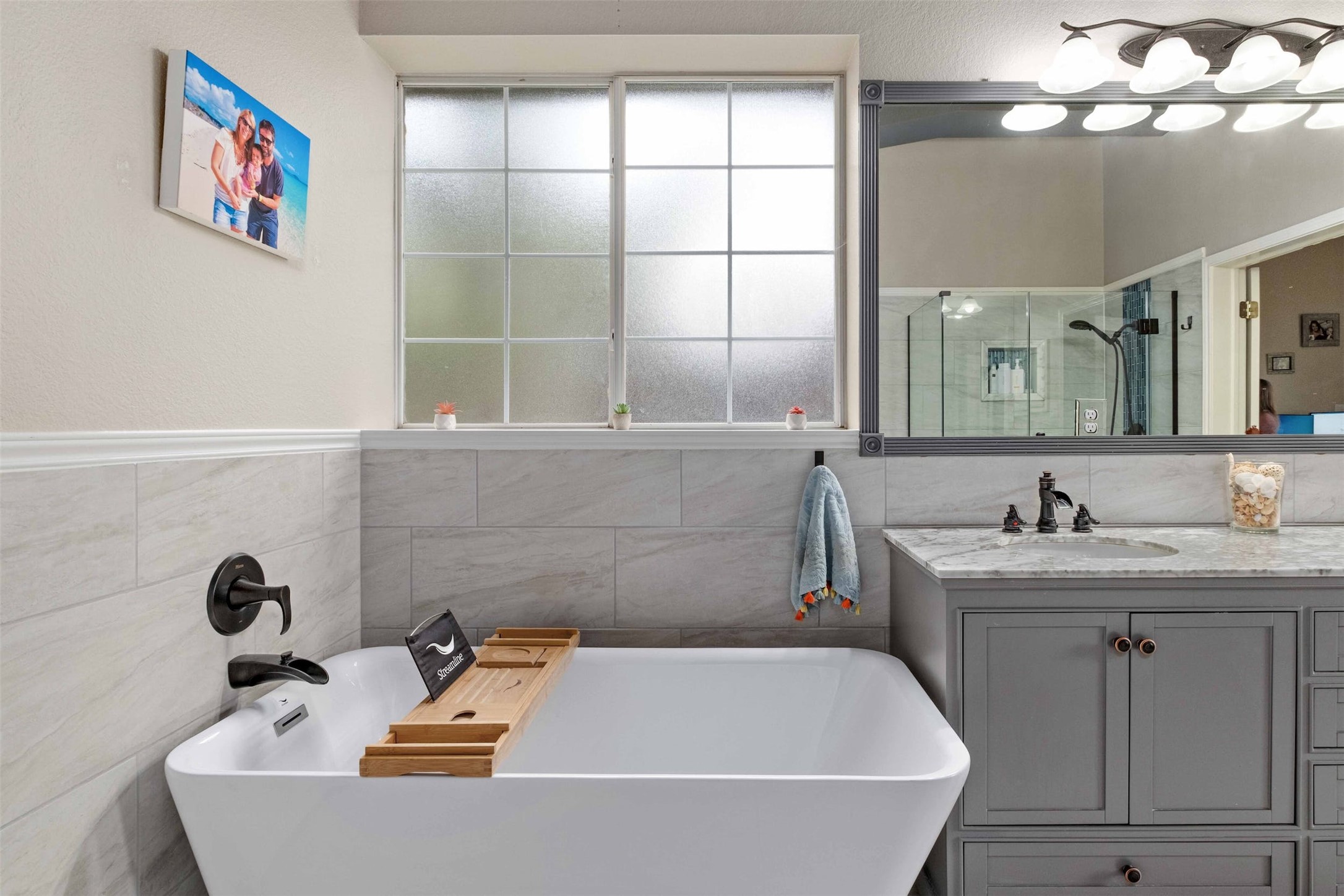 3704 Runnels Court Austin, TX 78732 - Photo 18 of 30 Bathroom featuring a shower, vanity, and a soaking tub