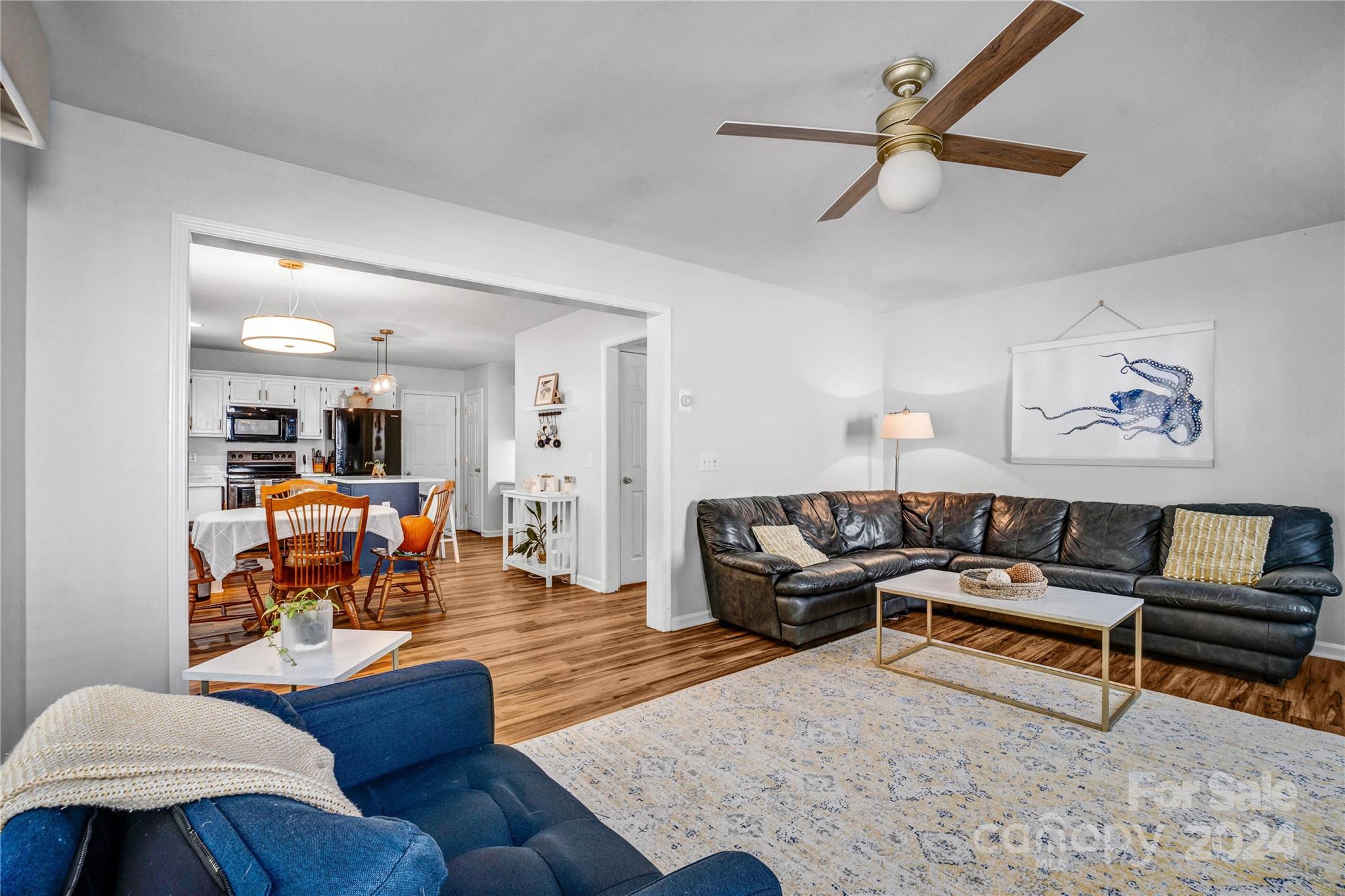 12502 Chickasaw Drive Huntersville, NC 28078 - Photo 13 of 39 a living room with furniture and a wooden floor
