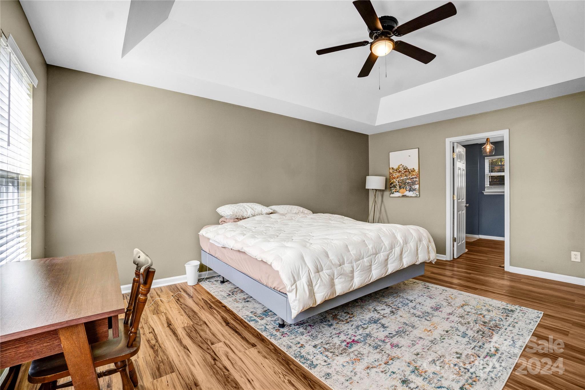 12502 Chickasaw Drive Huntersville, NC 28078 - Photo 18 of 39 a bedroom with a bed and a table in it