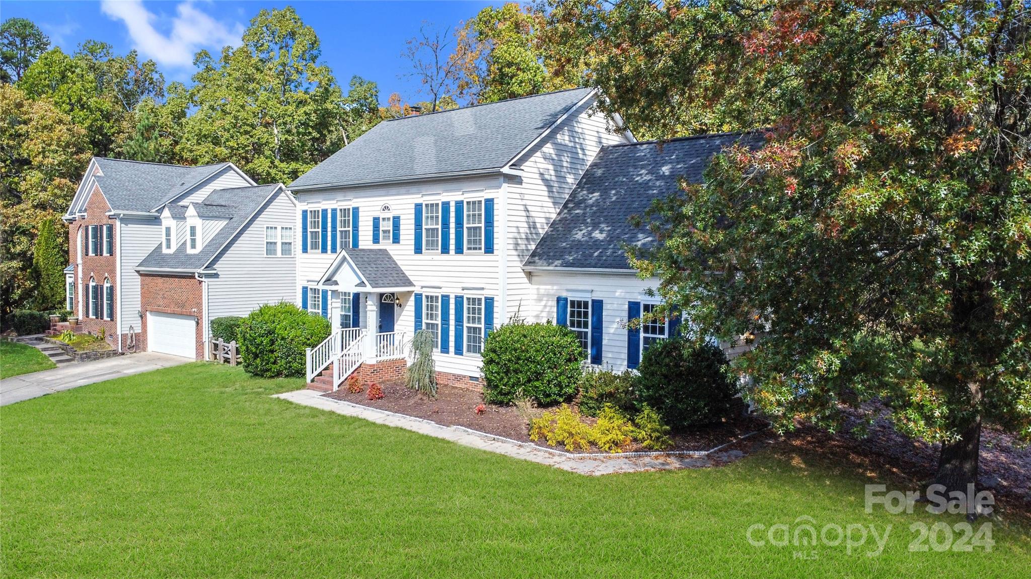 12502 Chickasaw Drive Huntersville, NC 28078 - Photo 2 of 39 a aerial view of a house next to a yard