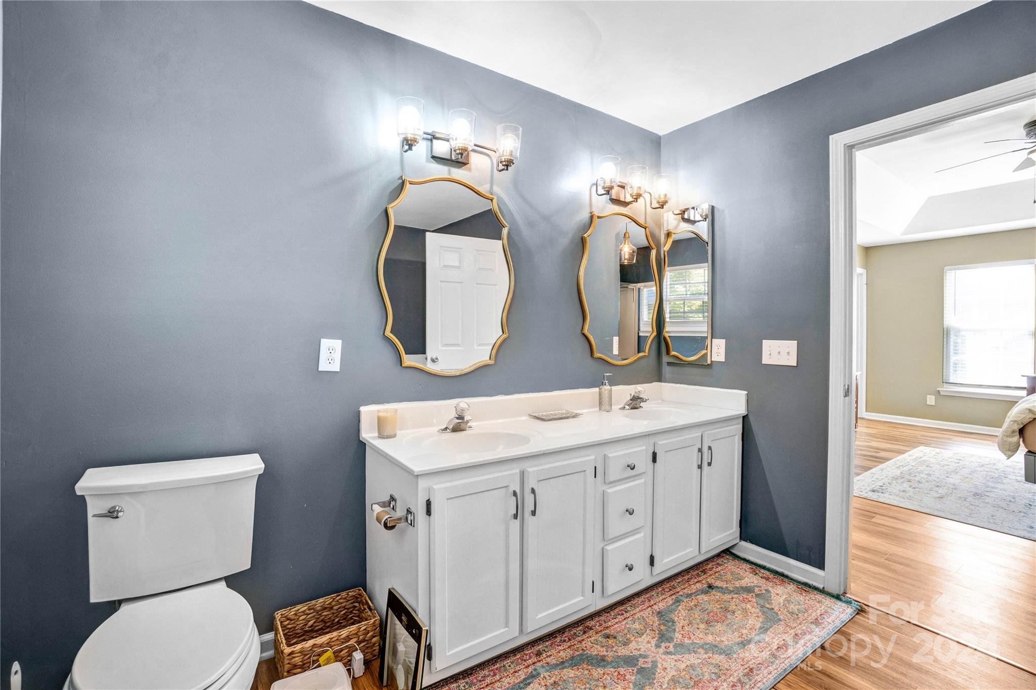 12502 Chickasaw Drive Huntersville, NC 28078 - Photo 21 of 39 a bathroom with a toilet sink and mirror