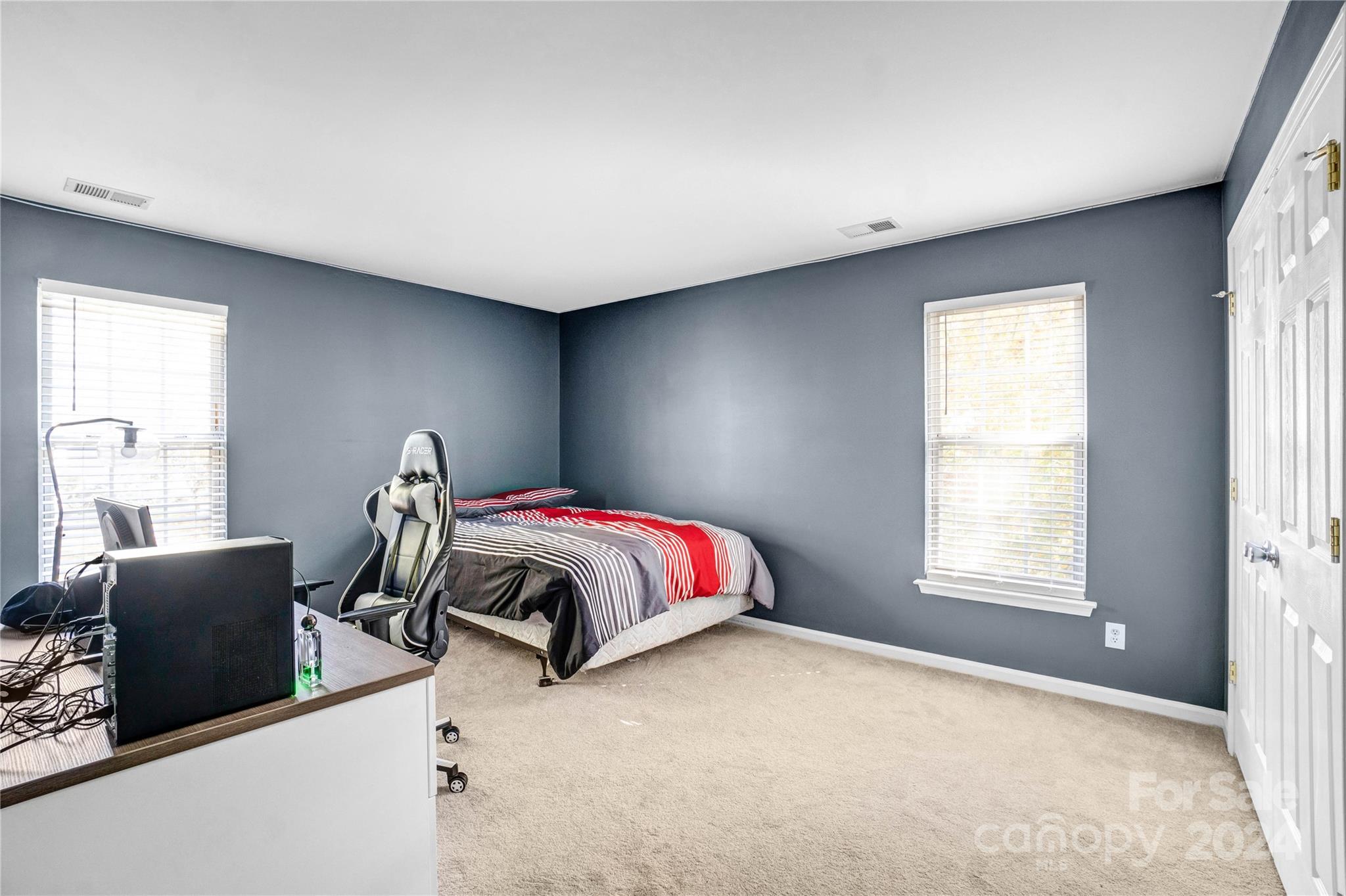 12502 Chickasaw Drive Huntersville, NC 28078 - Photo 22 of 39 a bedroom with a bed and window