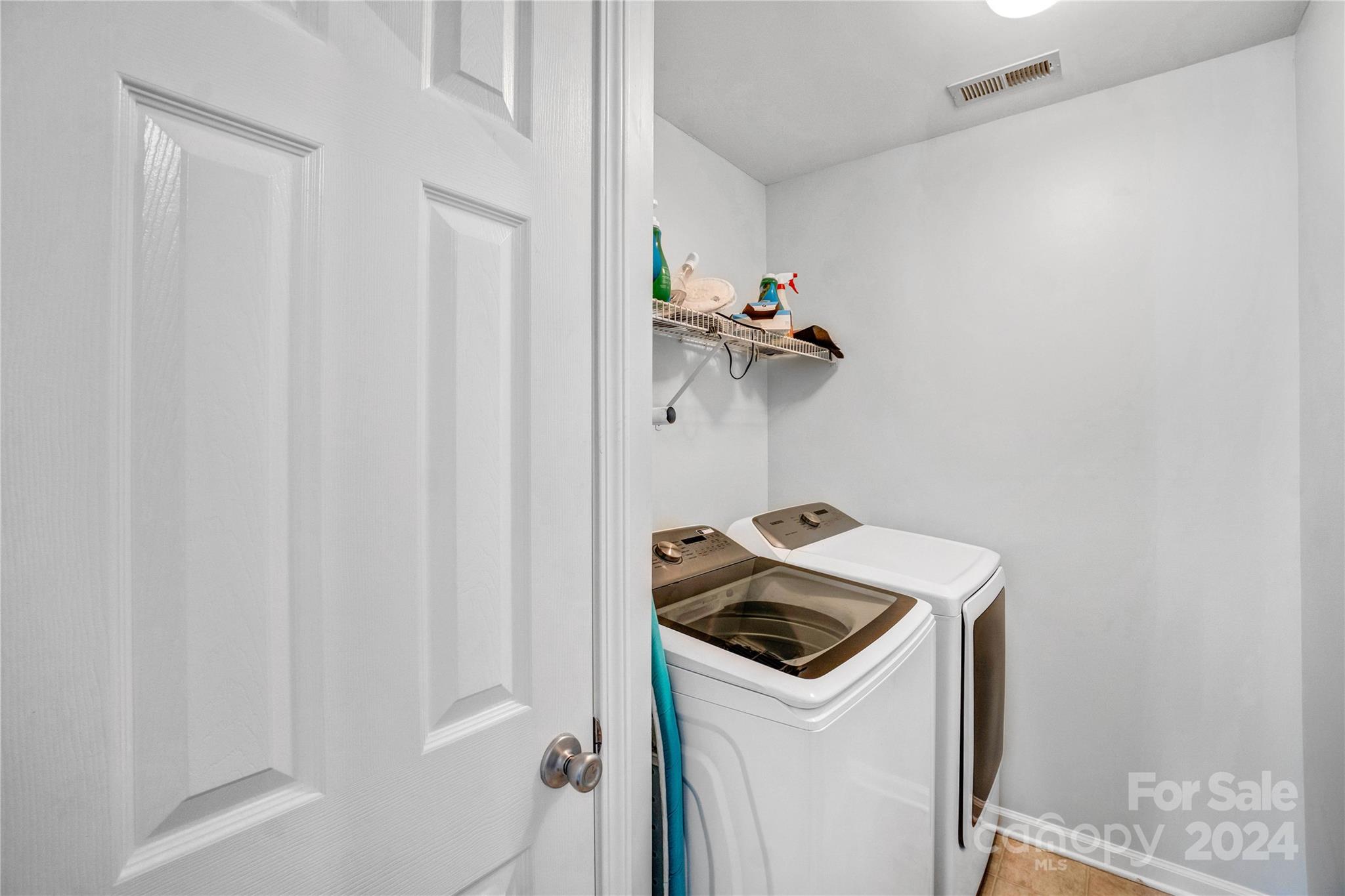 12502 Chickasaw Drive Huntersville, NC 28078 - Photo 27 of 39 a view of storage and utility room with washer and dryer