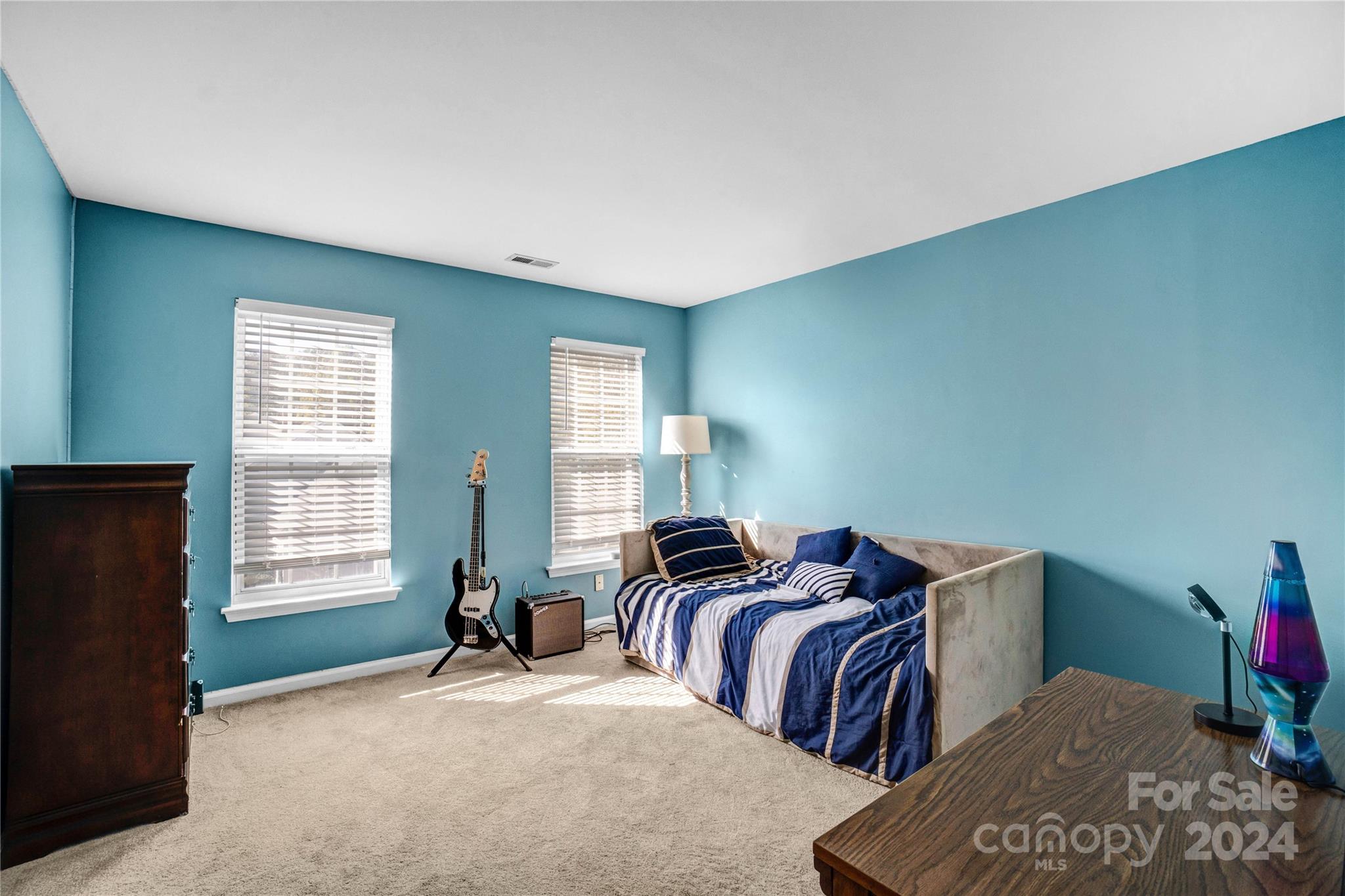 12502 Chickasaw Drive Huntersville, NC 28078 - Photo 28 of 39 a bedroom with two beds and a window