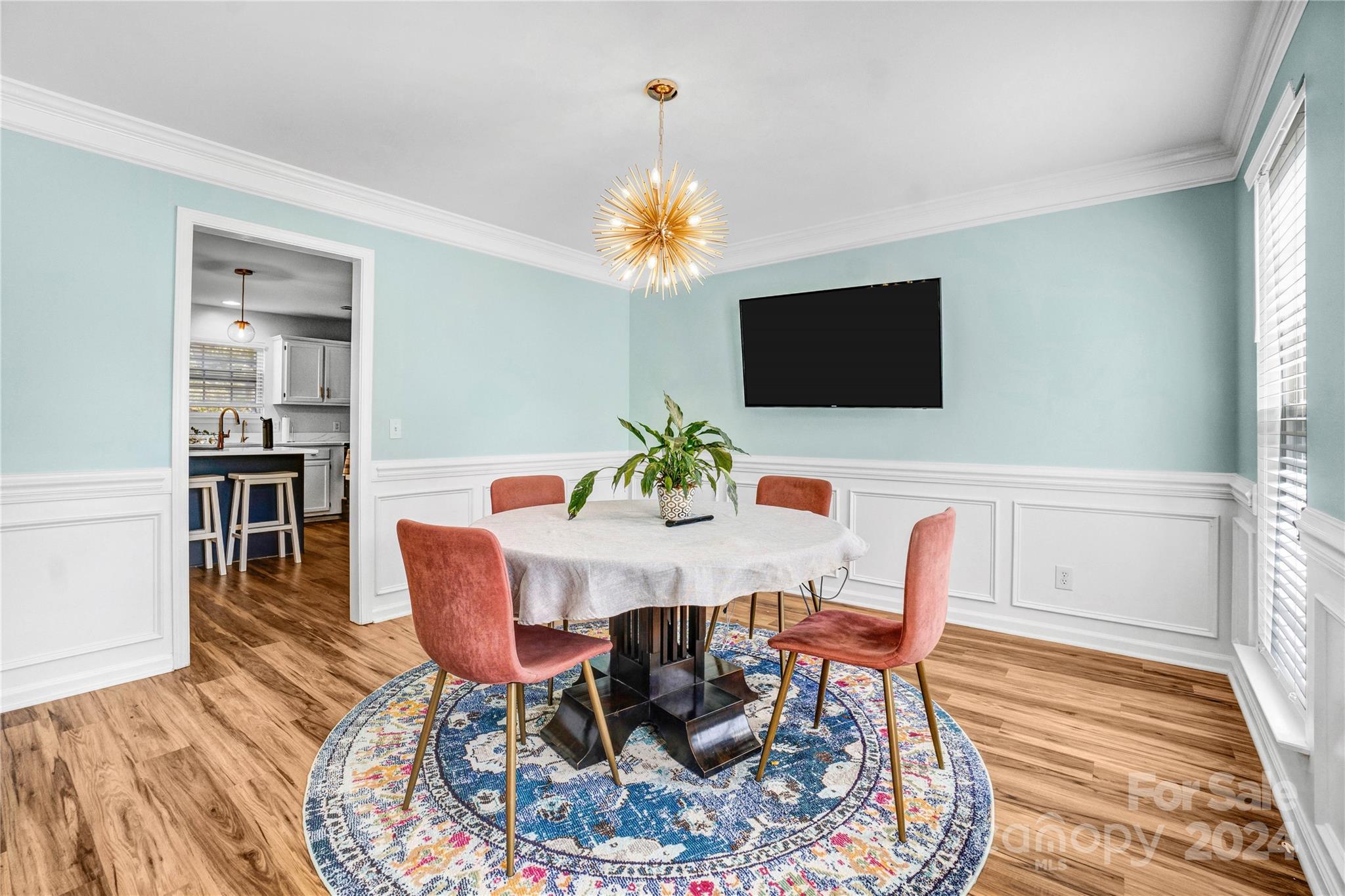 12502 Chickasaw Drive Huntersville, NC 28078 - Photo 5 of 39 a view of a dining room with furniture and wooden floor