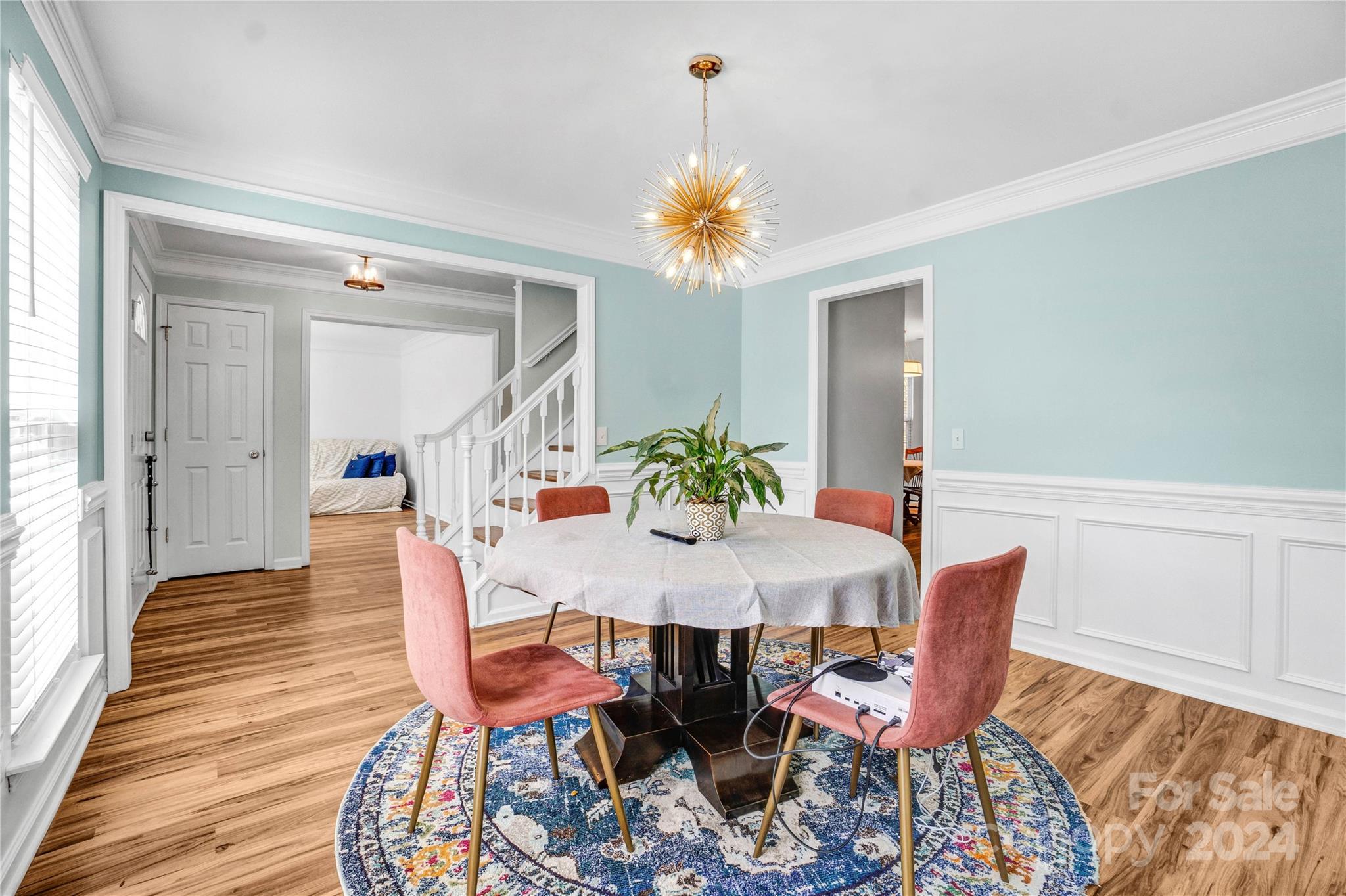 12502 Chickasaw Drive Huntersville, NC 28078 - Photo 6 of 39 a view of a dining room with furniture and wooden floor