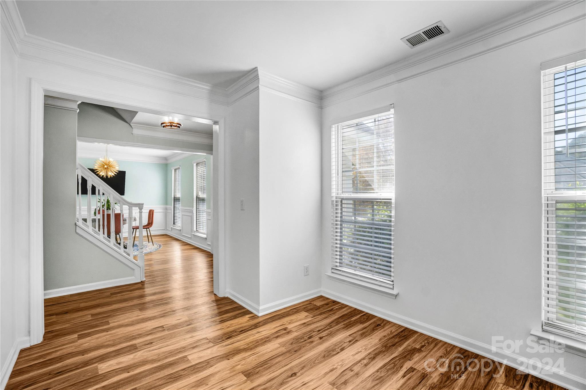 12502 Chickasaw Drive Huntersville, NC 28078 - Photo 8 of 39 a very nice looking room with wooden floor and a window
